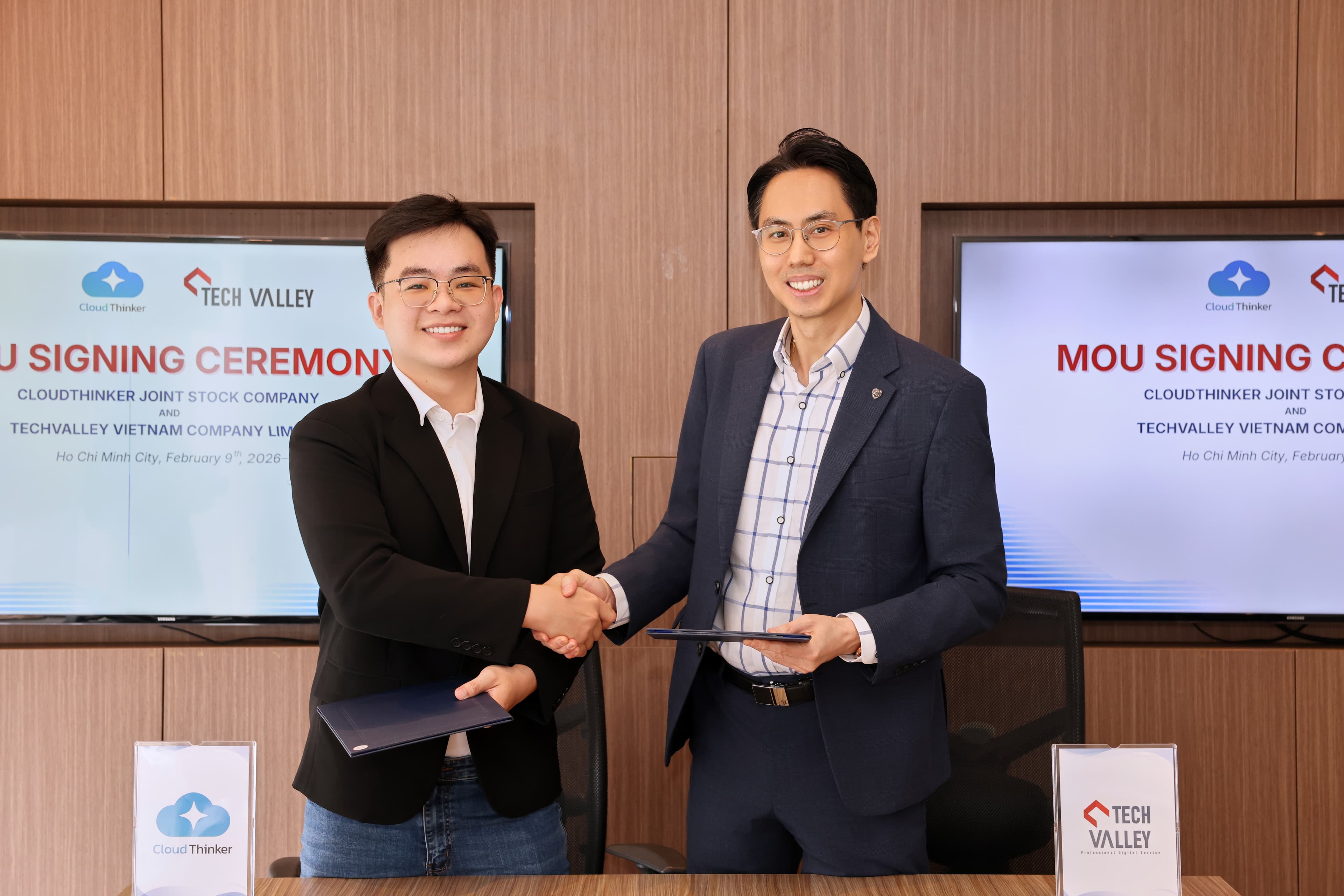 A firm handshake to seal the partnership, symbolizing a shared commitment to digital excellence and sustainable innovation.